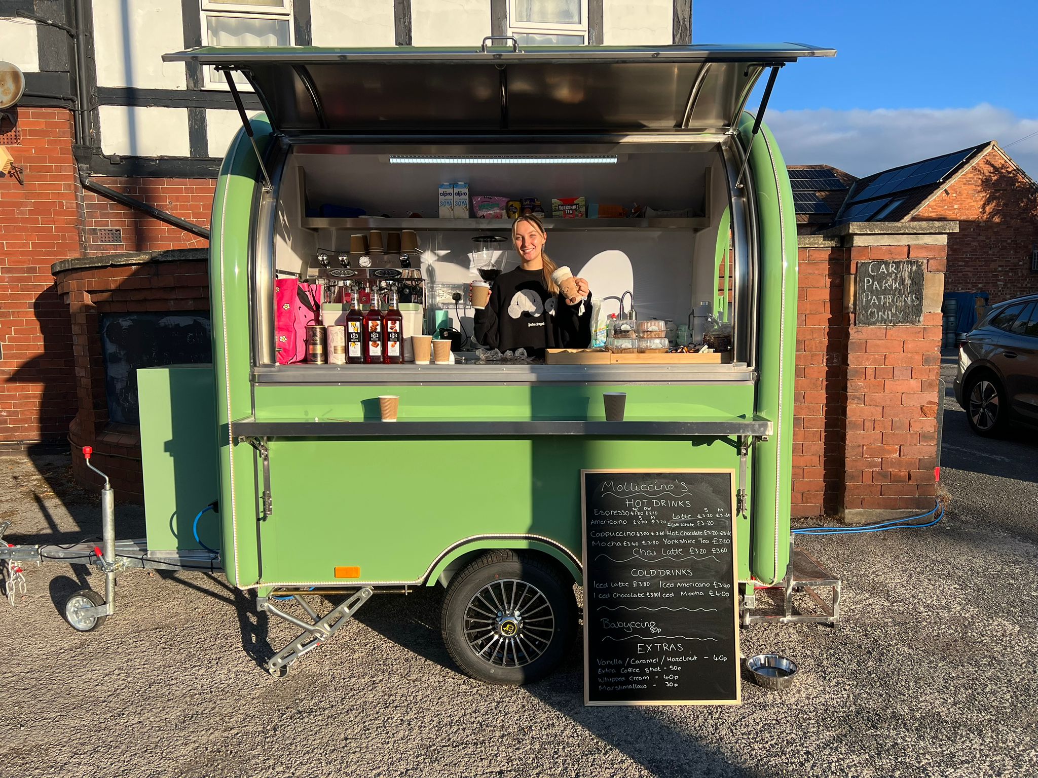Molly smiling at the Molliccino's trailer